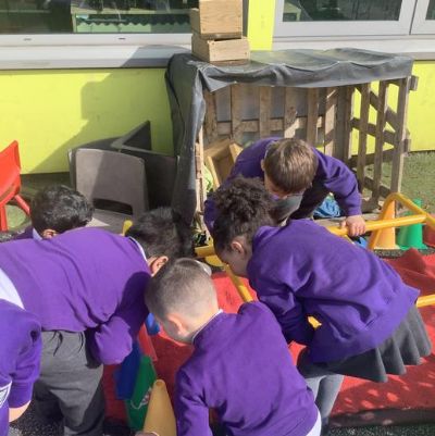 We have been inspired by our Power of Reading Story 'Argh Spider' and have been re-enacting it outside using construction to make the family house.