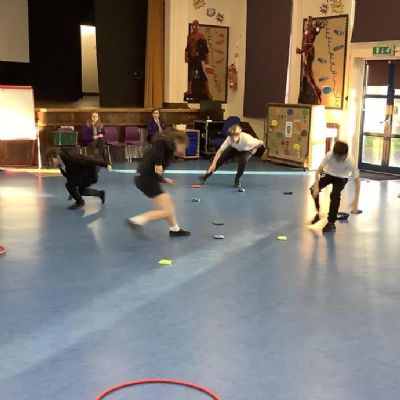 In PE, year 6 have enjoyed learning the game Bean Bag Raid. The aim is to get as many bean bags as you can into your team's hoop.