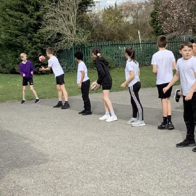 In PE, we learnt how to pass the ball to play a game of Tag Rugby.